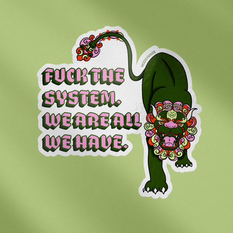 Sticker of a Chinese fu lion with text that reads, "Fuck the system. We are all we have."